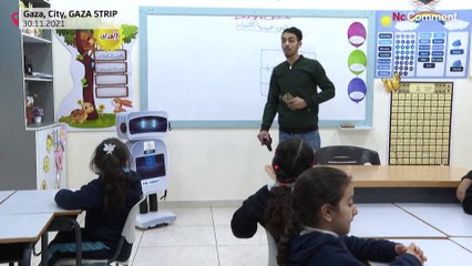 An educational robot interacts with students at a Gaza school.