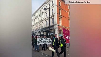 Members of Bristol University march down Park Street on first day of strike