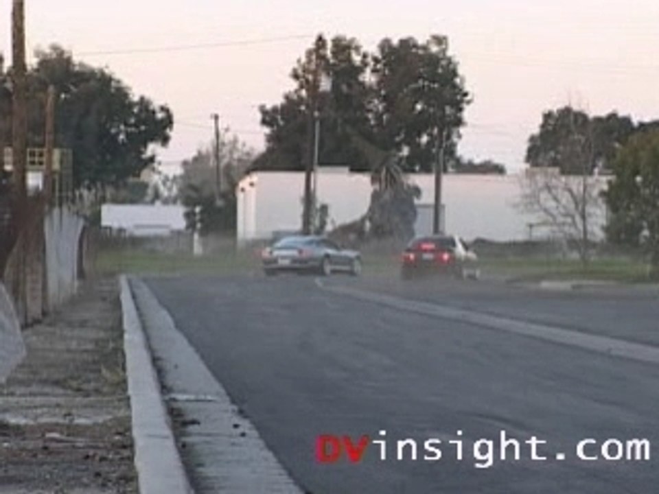 Booba avec sa ferrari