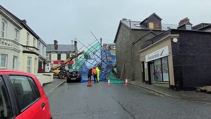 Workers clearing the scaffolding that fell because of Storm Barra