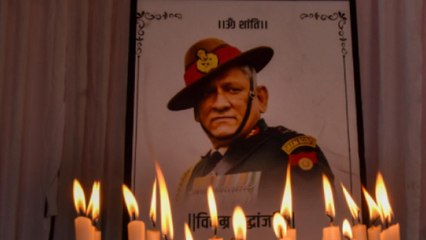 Civilians wait outside Bipin Rawat's home to pay homage