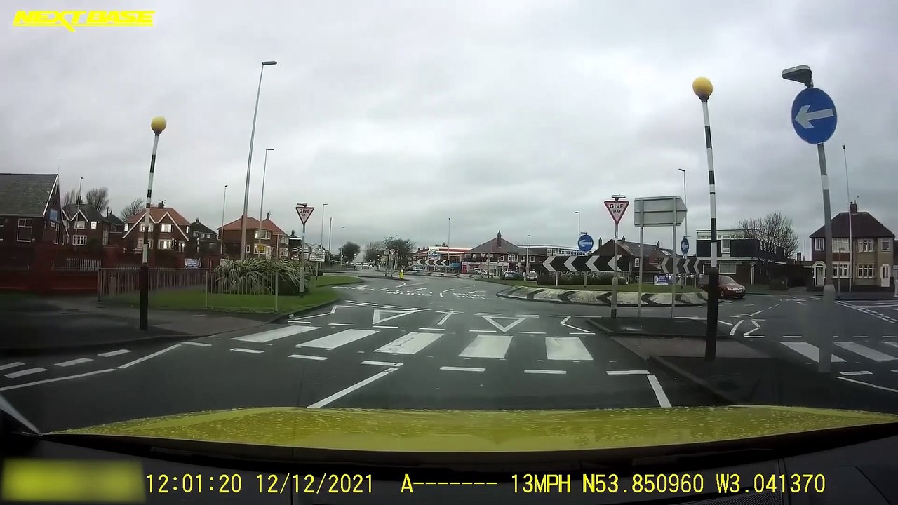 Car spotted  going the wrong way around a round...