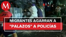 Migrantes se enfrentan con policías en carretera México-Puebla