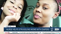 Nurse helps struggling moms with diapers