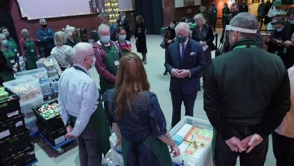 Charles and Camilla make Christmas visit to London foodbank