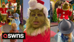 This amazing grinch impersonator is caught on camera having an adorable interaction with two young children.