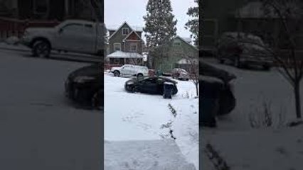 Cars Collide on Snowy Hill