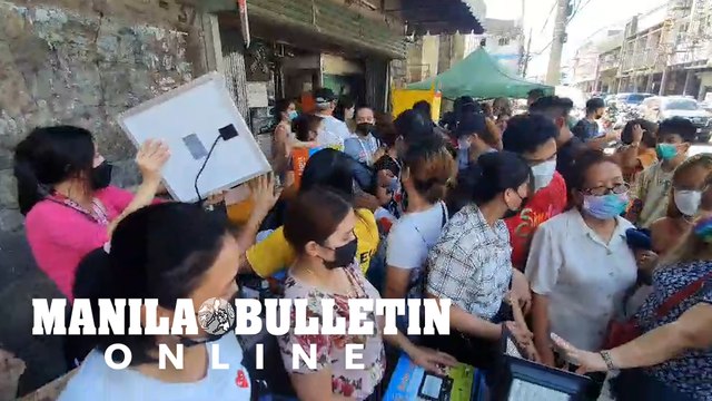 People flock in Downtown Cebu City to buy portable fans and solar panels