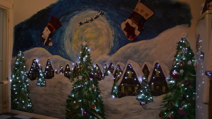Disabled artist creates Christmas mural in her kitchen