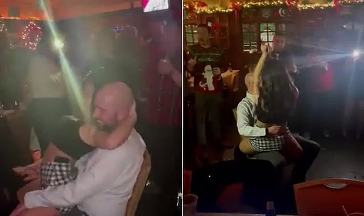 Shocking moment rookie cop performs a LAP DANCE for married NYPD lieutenant at their holiday party