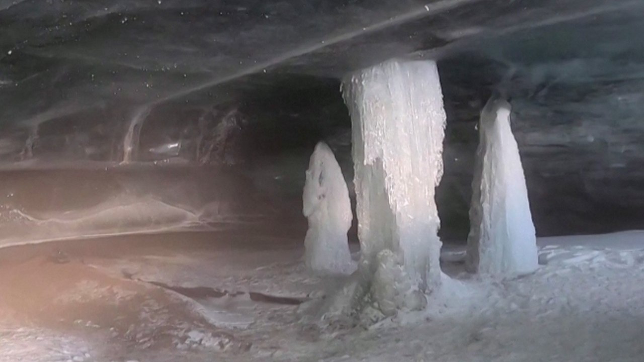 ‘Ice cathedral’ formed by snowmelt awes visitors in Swiss Alps