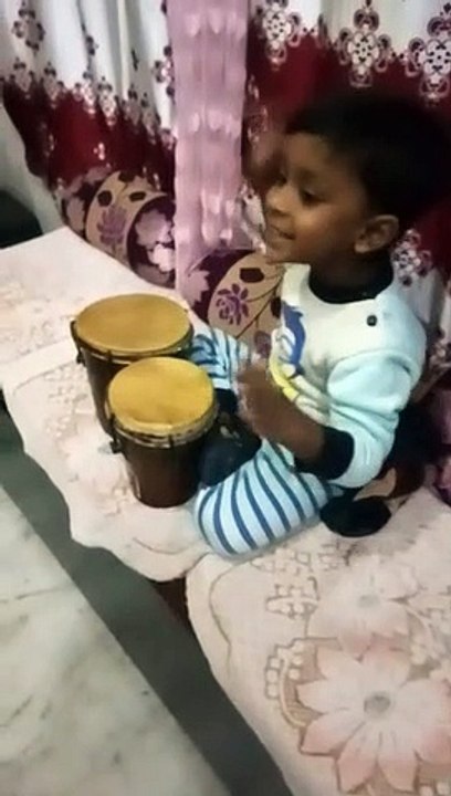 Enoch mark Ronald Singing and playing instruments.