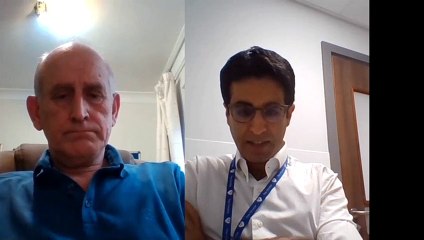 Neil Bridgstock thanks his surgeon at a Manchester hospital after being cancer-free for five years