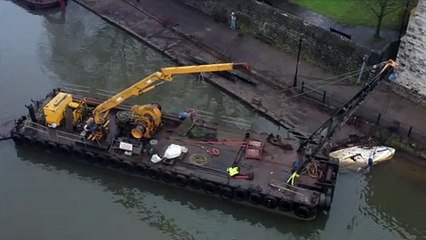 The burnt out Embankments restaurant is towed away