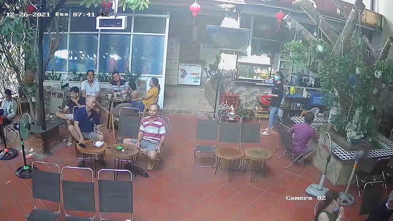 Man Drinking Coffee Dodges Falling Tree in Restaurant