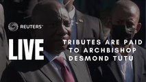 People pay tribute to Archbishop Desmond Tutu outside his residence