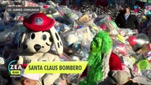 Santa Claus bombero entrega juguetes a niños de escasos recursos
