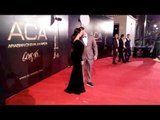 أحمد الفيشاوي يُقبل زوجته في حفل جوائز السينما العربية