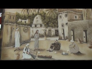 أحمد وهبة يرسم لوحات بالرمال منذ 29 سنة