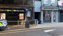 Police guard cordon outside Stone Roses Bar on Lower Briggate after assault