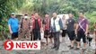 Floods: Sabah Bomba rescues man and puppy stranded for 36 hours by swollen river