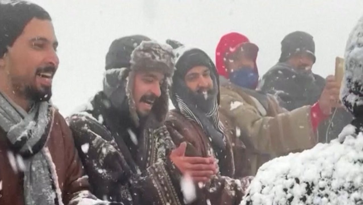 Saudi men celebrate snow with traditional folk dance