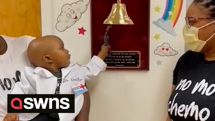 Heartwarming moment two-year-old finally rings the bell to signify the end of chemo in the comfort of his fathers arms