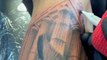 Tattoo Artist Inks Gladiator's Tattoo On Person's Arm