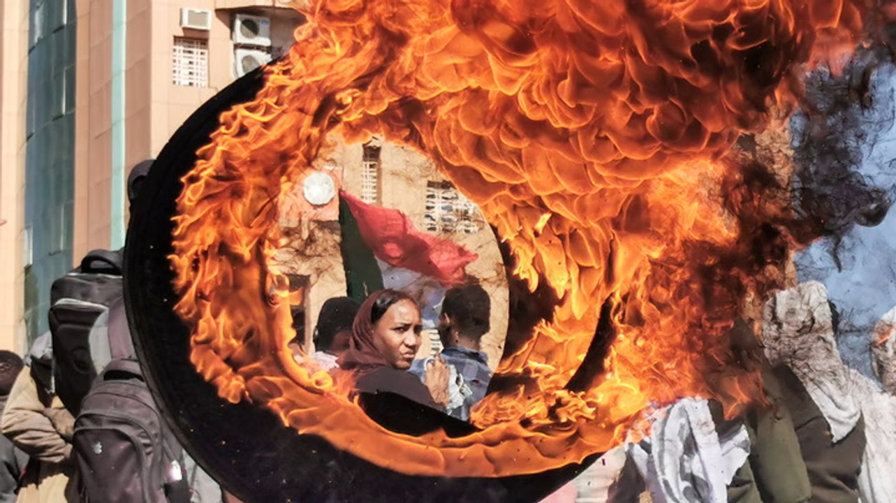Security forces and protesters fire tear gas at each other in deadly Sudan protests