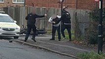Shocking moment knifeman lunges at two police officers in broad daylight