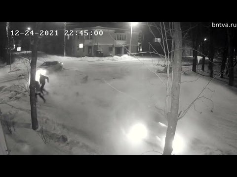 Two Pedestrians Narrowly Escape Collision at Intersection