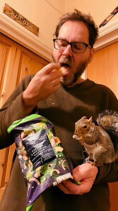 Squirrel and Dad Bond Over Snacks