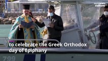 Annual Greek Orthodox cold water plunge causes a splash on day of Epiphany