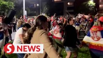 Novak Djokovic supporters dance outside his hotel
