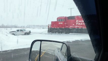 Train Pulls Stuck Truck From Snowbank