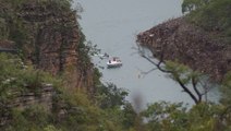 Terrifying moments caught on camera as a cliff collapses onto tourists on a Brazilian lake