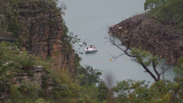 Terrifying moments caught on camera as a cliff collapses onto tourists on a Brazilian lake