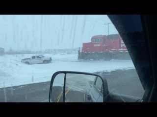Train Pulls Stuck Truck From Snowbank