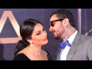 أحمد الفيشاوي وزوجته.. قبلات لا تتوقف على «السجادة الحمراء»