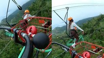 'Rider slips off bike while riding a zipline several feet above the ground'