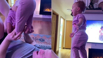 ''She's a natural!' Daddy & toddler duo perform an impressive cheerleading stunt '