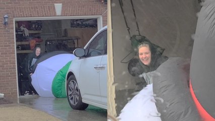 'Frosty the inflatable snowman takes flight on a windy day & gives its owner a run for her money '