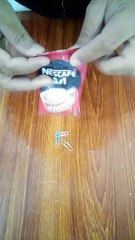 Nescafe coffee and paper clips.