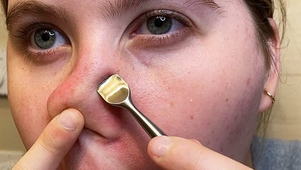 Curved spatula scrapes gunk from pores