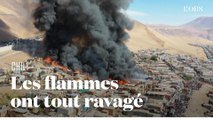 Les impressionnantes images d'un camp de fortune partiellement réduit en cendres au Chili