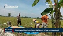 Bhabinkamtibmas Gantikan Pekerjaan Petani Demi Terlaksanakannya Vaksinasi
