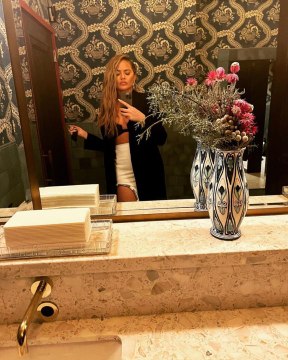 Chrissy Teigen Wore a Blazer With Only a Bra Underneath for Dinner