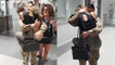 'Wife jumps into military husband's arms at airport following his return from mission'