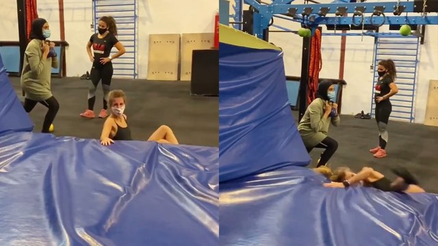 'Fitness trainer overshoots her front flip attempt and suffers embarrassing fail'