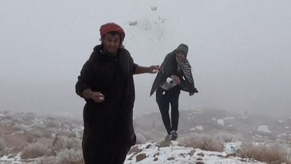 People in Saudi Arabia visit mountain to experience the cold weather